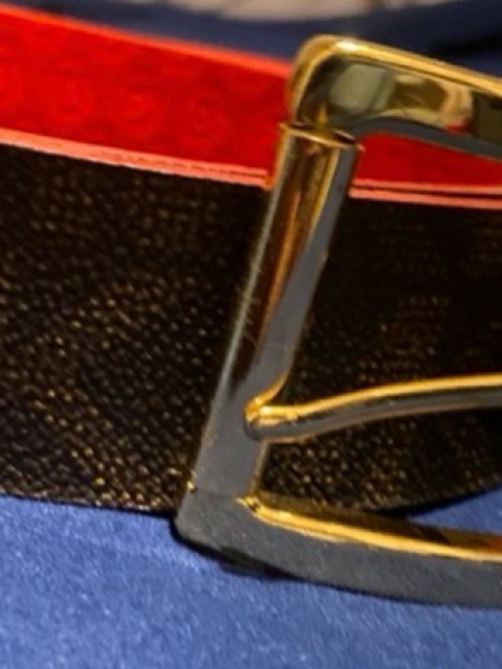 Michael Kors reversible red side and brown on the other side.Gold buckled X/L.